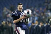 FILE - In this Jan. 4, 2020, file photo, New England Patriots quarterback Tom Brady warms up be ...
