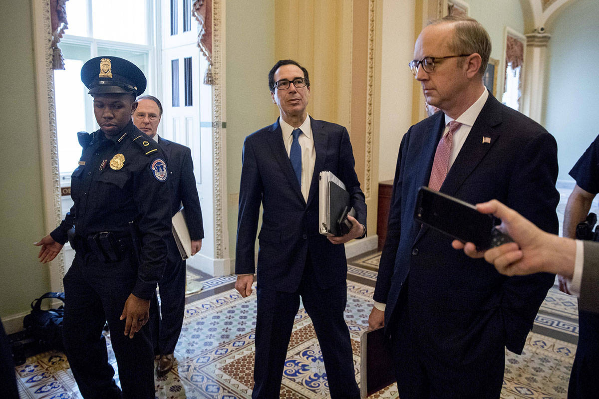 Treasury Secretary Steven Mnuchin, center, accompanied by White House Legislative Affairs Direc ...