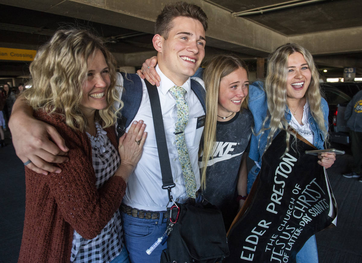 In this Sunday, March 22, 2020 photo, the Preston family from Kaysville, Utah, welcomes home El ...