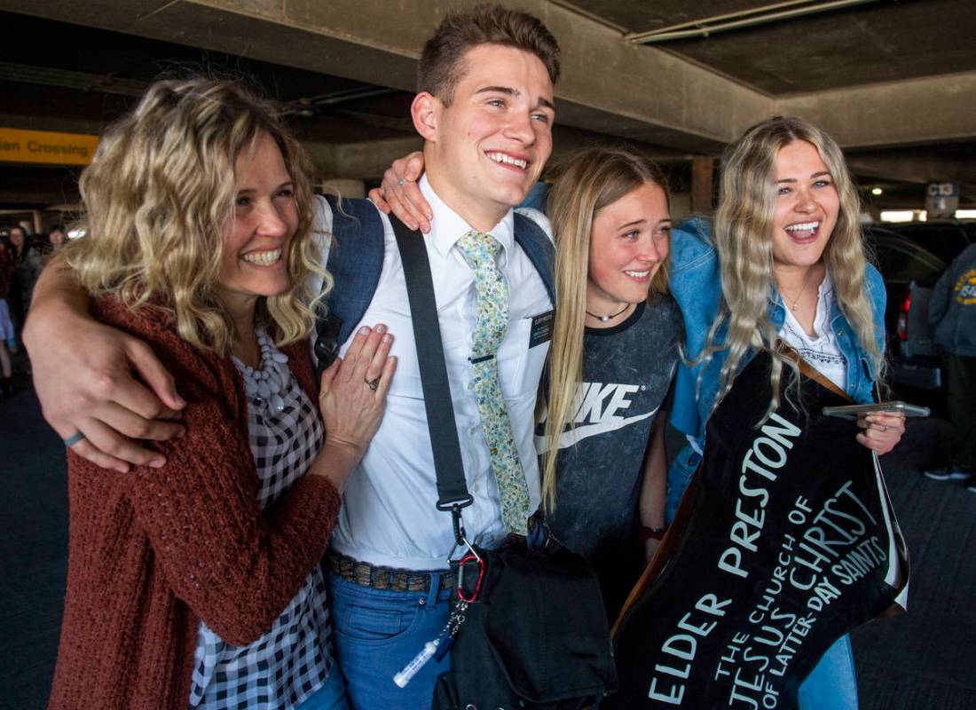 In this Sunday, March 22, 2020 photo, the Preston family from Kaysville, Utah, welcomes home El ...