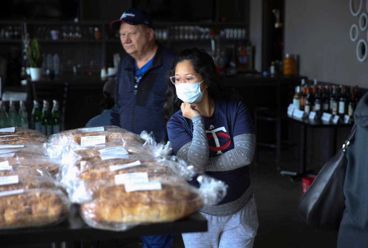 Gil Ledell, right, and her father-in-law Bob Ledell, both of Las Vegas, shop at Locale Italian ...