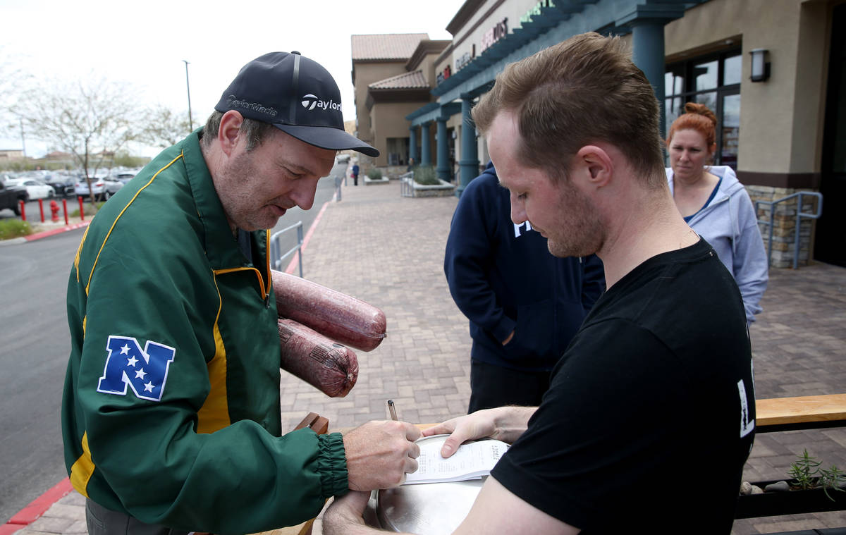 Richard Zenner of Las Vegas, left, shops with Assistant General Manager Danny Crinson at Locale ...