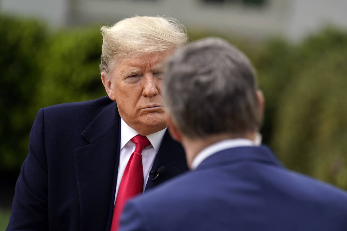 President Donald Trump speaks with Fox News Channel Anchor Bill Hemmer during a Fox News Channe ...