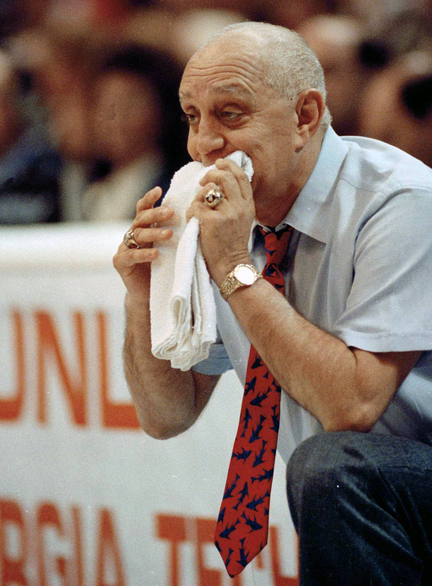 FILE - In this April 2, 1990, file photo, UNLV coach Jerry Tarkanian chews on his towel while w ...
