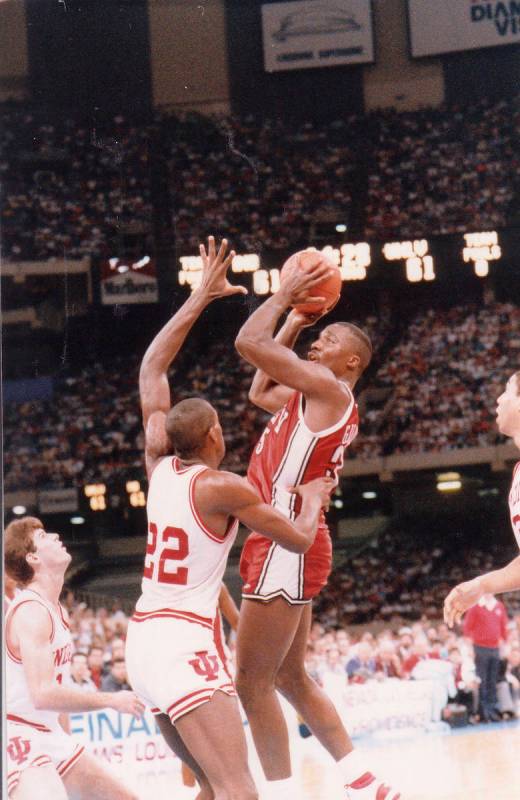 UNLV basketball player Armon Gilliam goes up over Indiana players during their NCAA Final Four ...