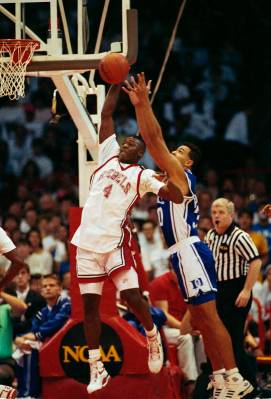 UNLV forward Larry Johnson gets set to fire off a shot beyond the defensive reach of Duke's Ala ...