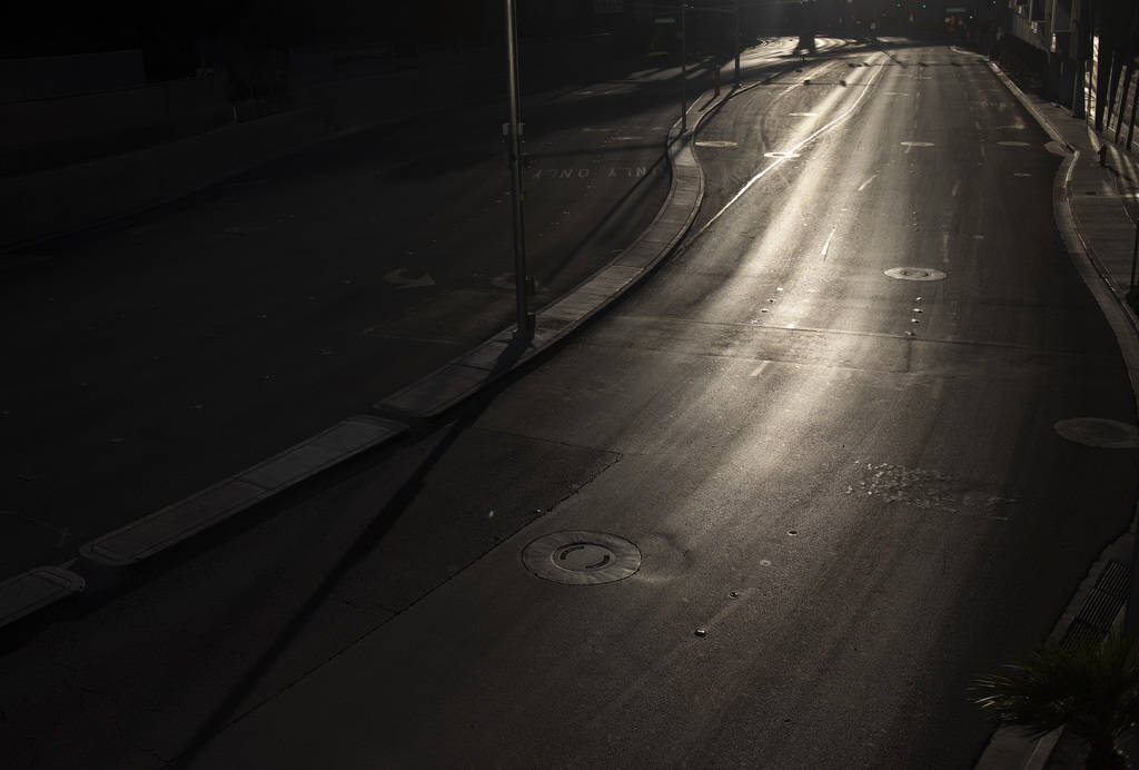 West Harmon Avenue, in between Aria and Cosmopolitan, is empty as the sun sets on the Strip on ...