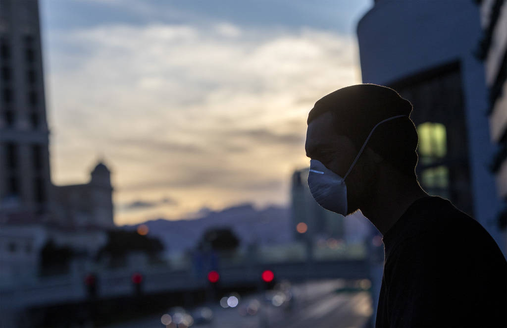 Nick Torres watches the sun set with friends on the Las Vegas Strip on Tuesday, March 24, 2020, ...