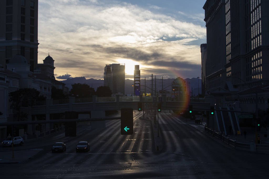 The sun sets on the Strip on Tuesday, March 24, 2020, in Las Vegas. (Ellen Schmidt/Las Vegas Re ...