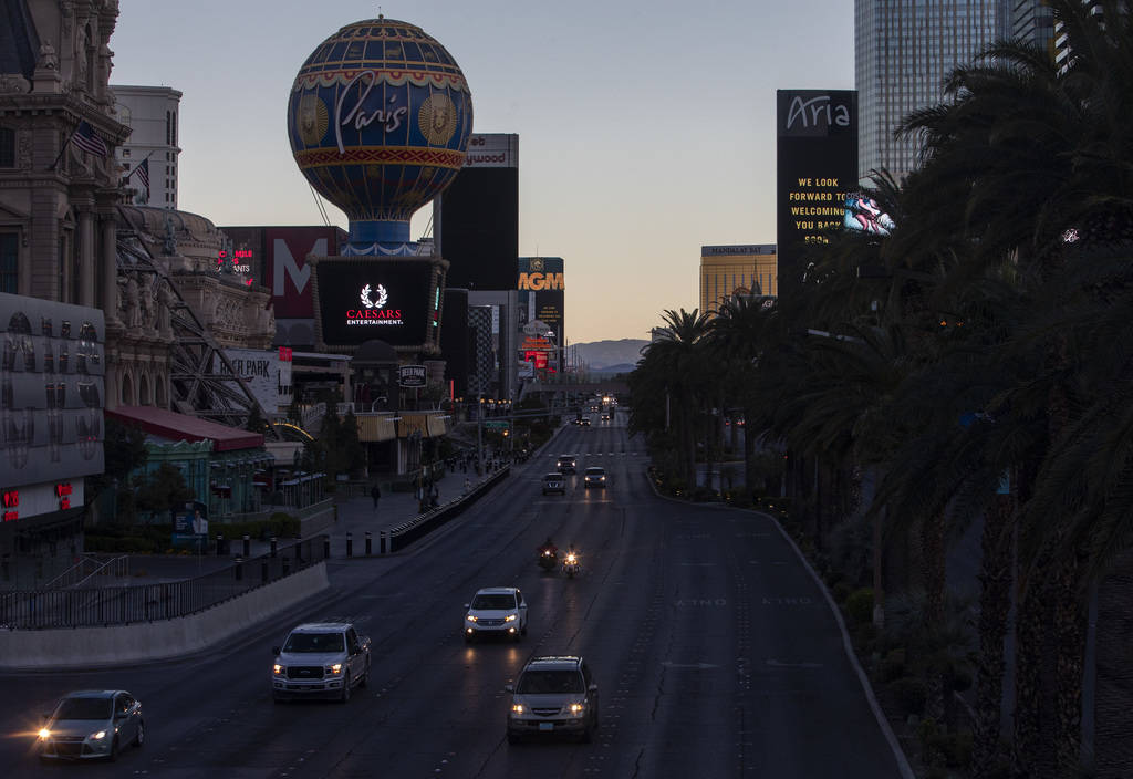 The sun sets on the nearly empty Strip on Tuesday, March 24, 2020, in Las Vegas. (Ellen Schmidt ...