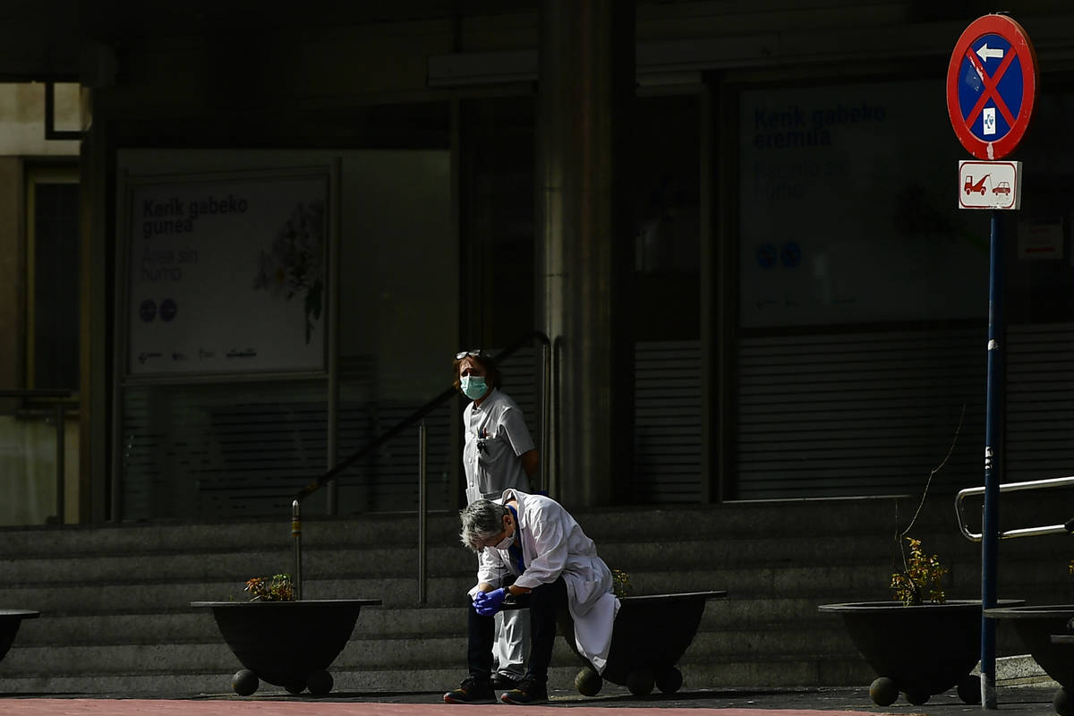 FILE, In this Friday March 20, 2020 file photo, health services staff members protest outside t ...