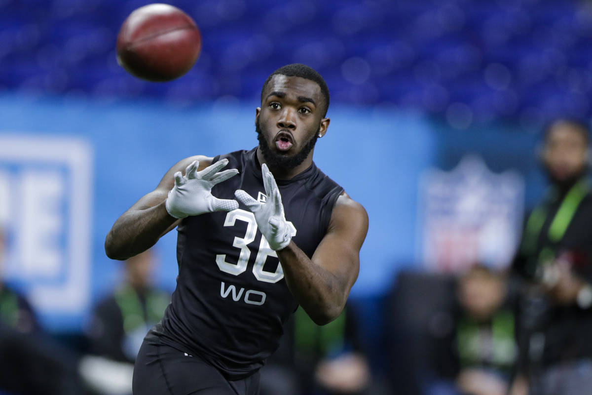 Baylor wide receiver Denzel Mims runs a drill at the NFL football scouting combine in Indianapo ...