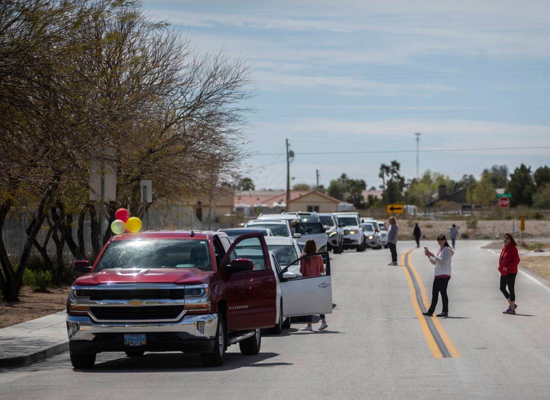 Teachers and staff from OՒoarke Elementary School get ready to begin a parade they organi ...