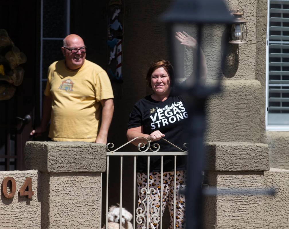 Las Vegas residents wave to teachers and staff from O’Roarke Elementary School who organ ...