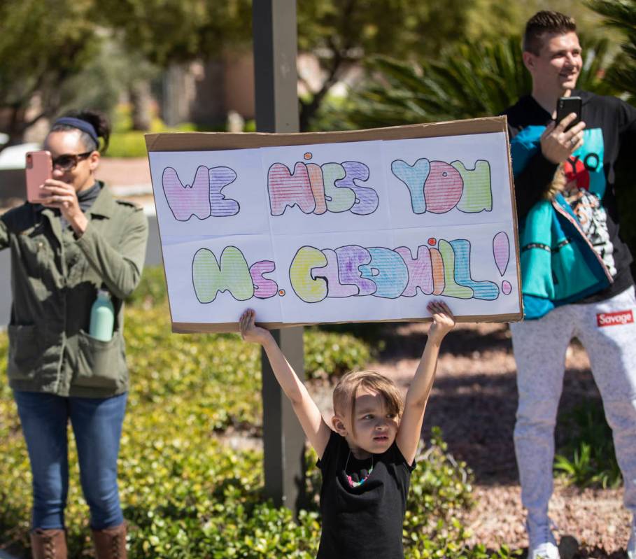 Las Vegas residents wave to teachers and staff from O’Roarke Elementary School who organ ...