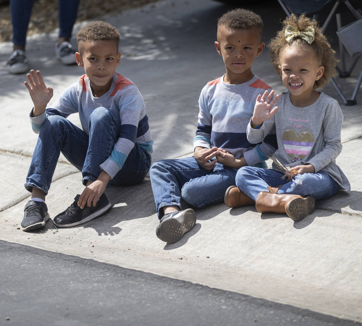 Las Vegas residents wave to teachers and staff from O’Roarke Elementary School who organ ...