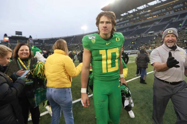 Oregon quarterback Justin Herbert (10) walks off field following an NCAA college football game ...