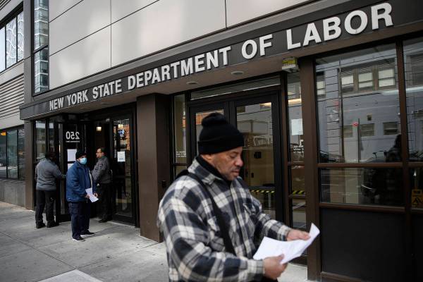 In a March 18, 2020, file photo, visitors to the Department of Labor are turned away at the doo ...