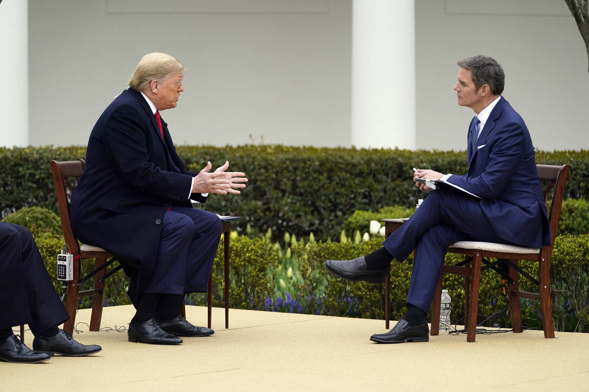 President Donald Trump speaks with Fox News Channel Anchor Bill Hemmer during a Fox News Channe ...