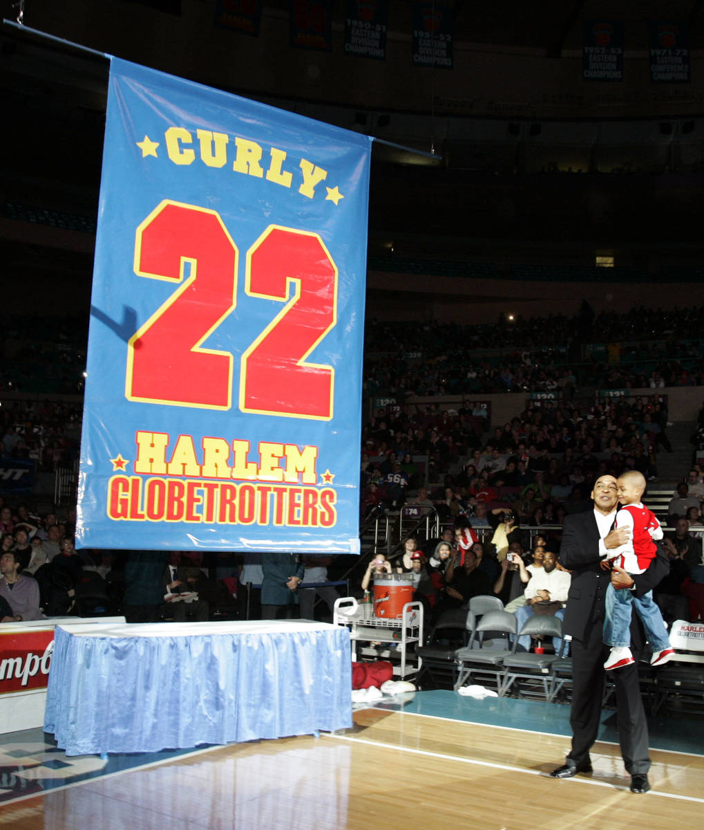 FILE - In this Feb. 15, 2008, file photo, Harlem Globetrotters' Fred "Curly" Neal loo ...