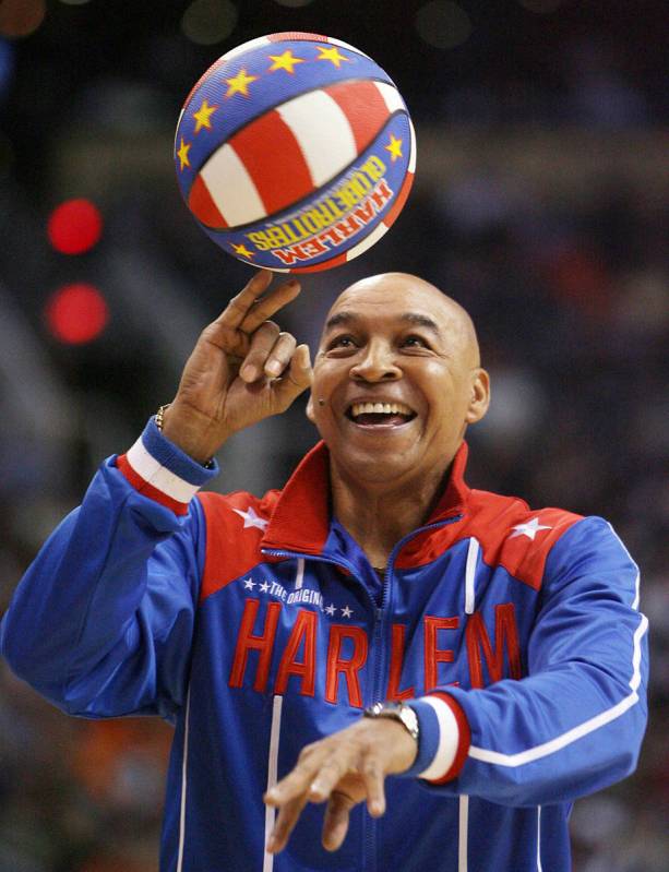 The Harlem Globetrotters' Fred "Curly" Neal performs during a timeout in the second q ...