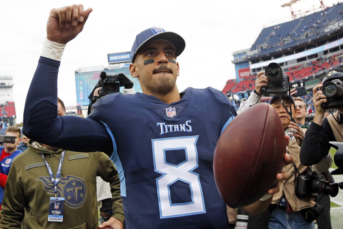 Tennessee Titans quarterback Marcus Mariota (8) leaves the field after the Titans beat the New ...