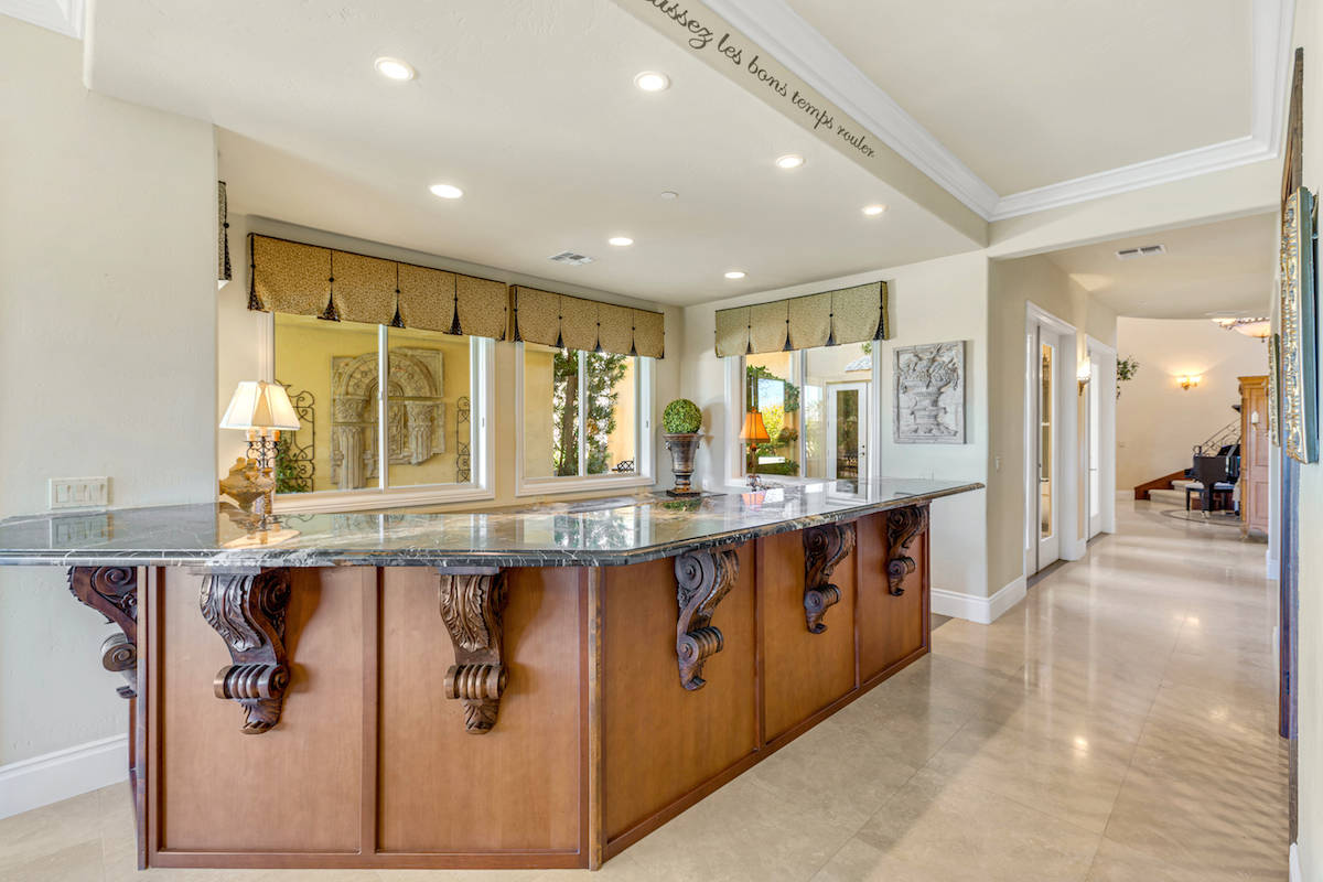 The wet bar has a lengthy Michelangelo marble counter. (Red Luxury Real Estate)