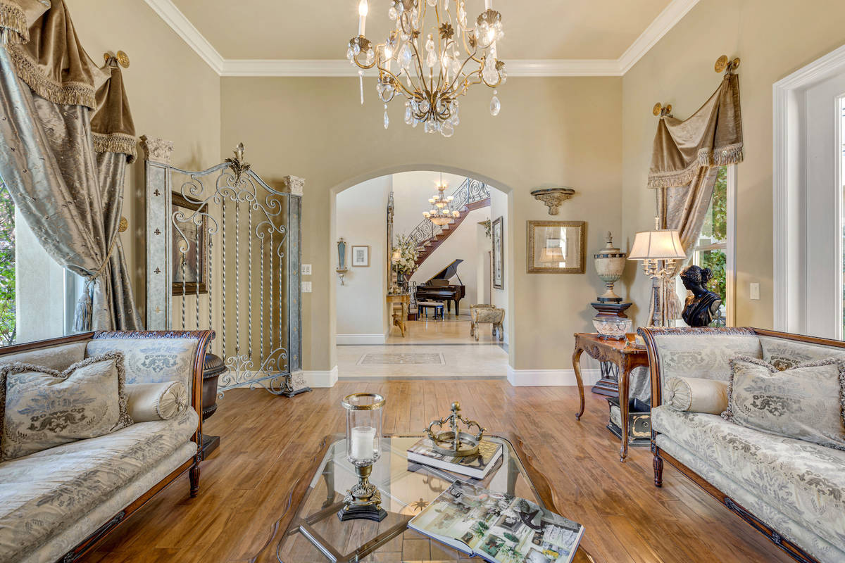 A parlor off the entry features hand-scraped cherry hardwood flooring. (Red Luxury Real Estate)