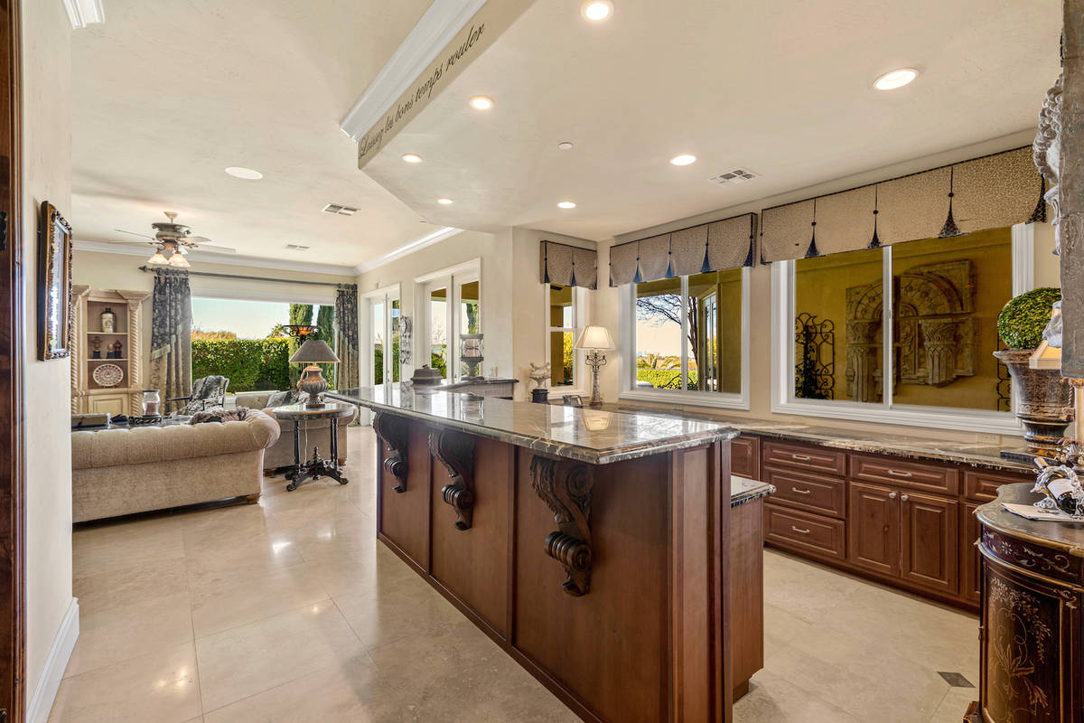 Red Luxury Real Estate The long bar has a Michelangelo marble counter, hidden shelf for bottle ...