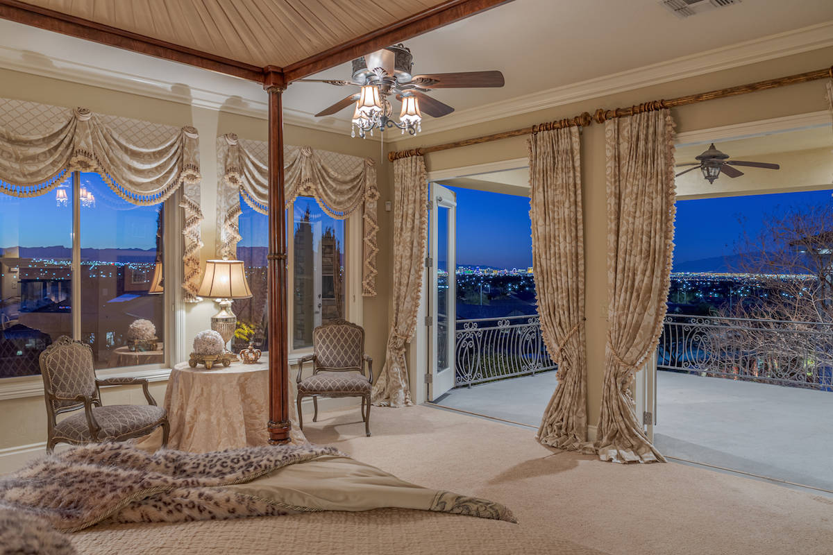 The large upper-level master suite has its own private balcony. (Red Luxury Real Estate)