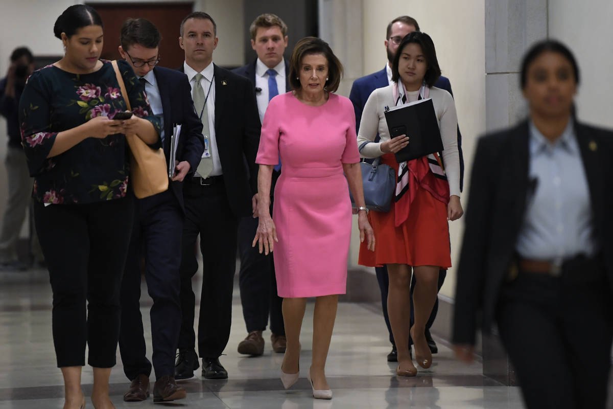 House Speaker Nancy Pelosi of Calif., heads to a news conference on Capitol Hill in Washington, ...