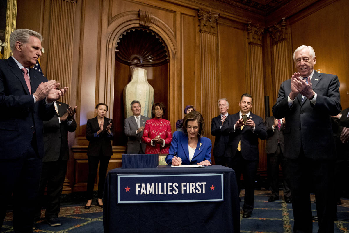 House Speaker Nancy Pelosi of Calif., accompanied by House Minority Leader Kevin McCarthy of Ca ...