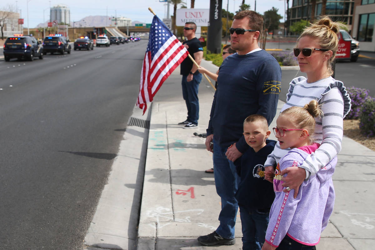 Las Vegas police Sgt. Matthew Harris with his wife Carly, and children Jacob, 5, and Olivia, 6, ...