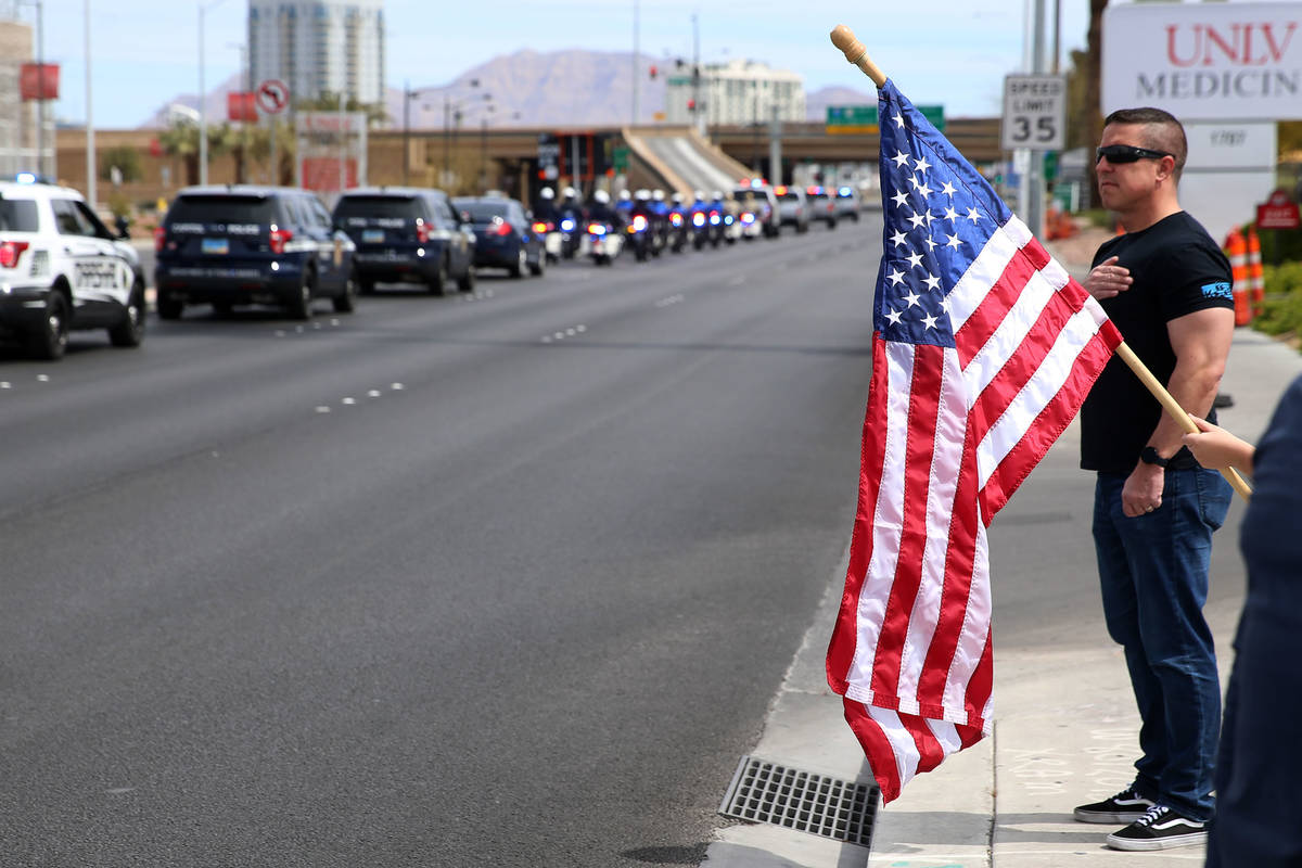 Las Vegas police Lt. Jeff Clark watches the procession for Nevada Highway Patrol Sgt. Benjamin ...