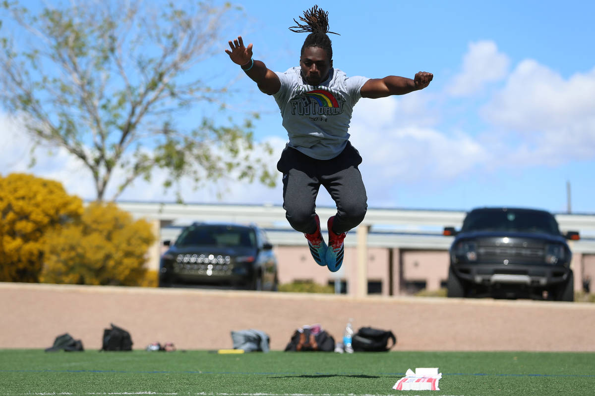 University of Hawai'i football graduate Ikem Okeke tests for his broad jump at the All American ...