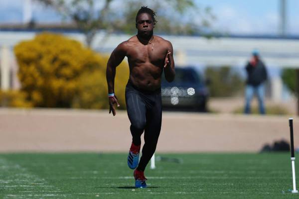 University of Hawai'i football graduate Ikem Okeke runs the 40-yard dash at the All American Pa ...