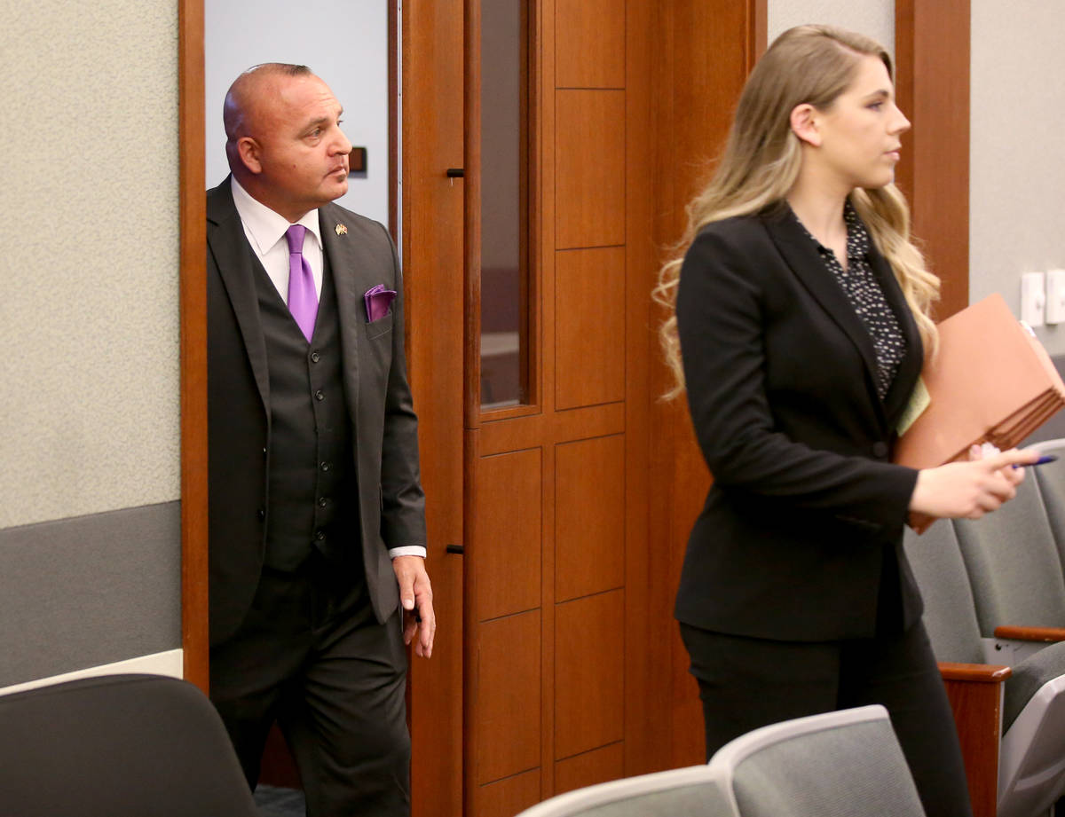 Las Vegas police Detective Lawrence Rinetti Jr. arrives in court with one of his attorneys, Col ...