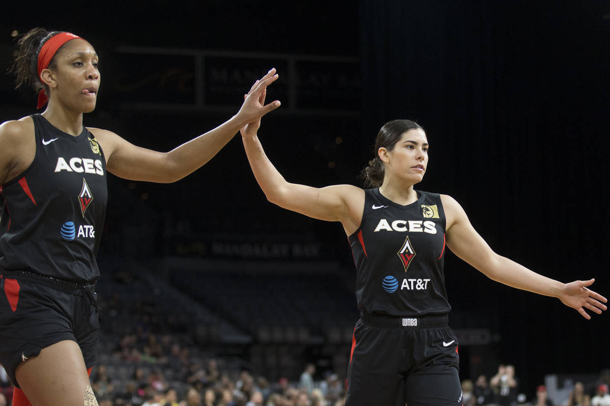 Las Vegas Aces guard Kelsey Plum (10) celebrates with Las Vegas Aces center A'ja Wilson (22) in ...