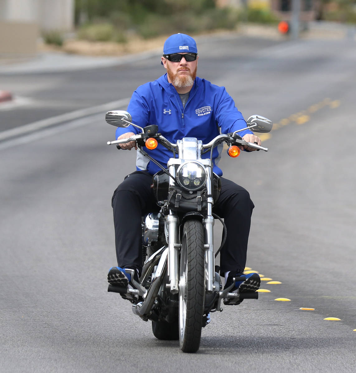 The New CSN men's basketball coach Russ Beck rides his motorcycle on High View Drive on Wednesd ...