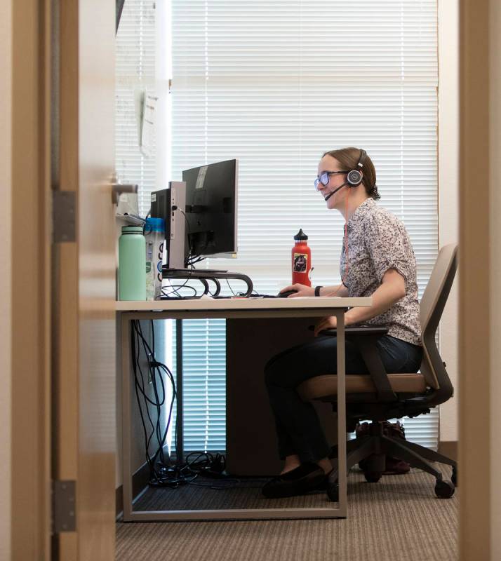 Emily Guyaux, a third-year medical student at UNLV, answers calls of potential coronavirus pati ...