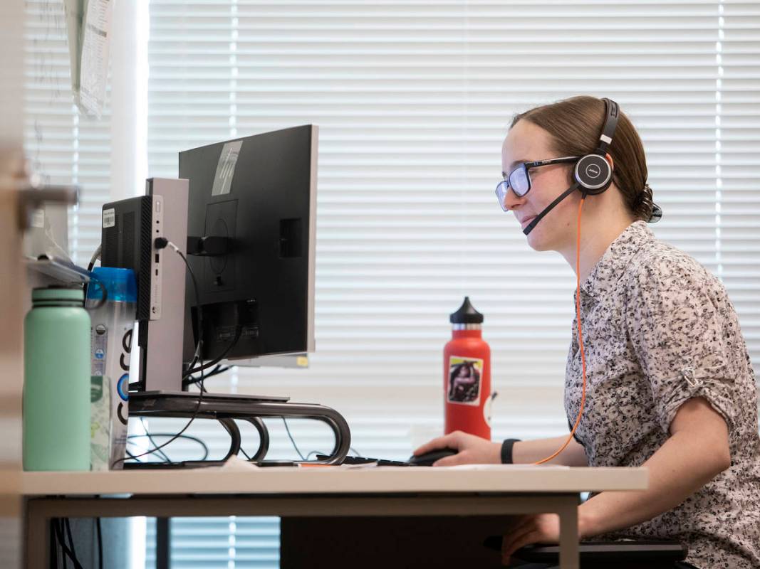 Emily Guyaux, a third-year medical student at UNLV, answers calls of potential coronavirus pati ...