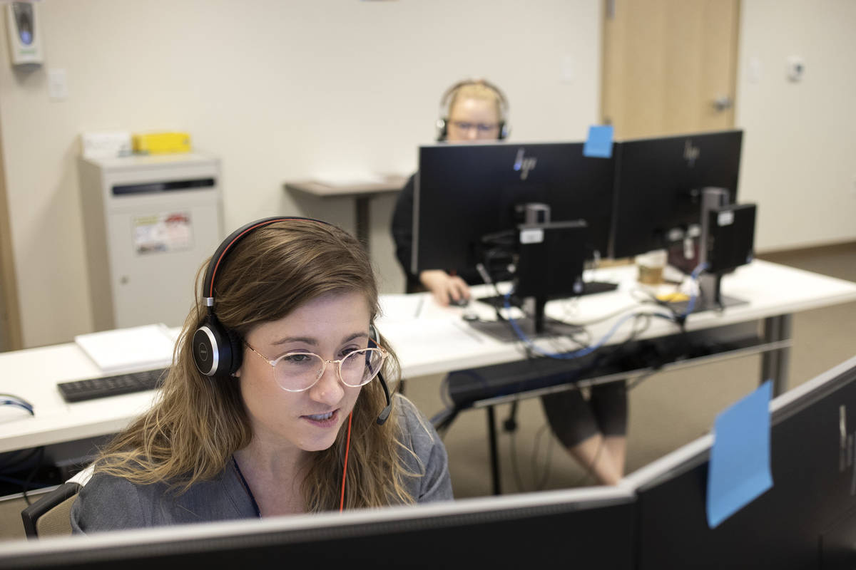 Danyelle Myers, a third-year OBGYN resident, answers calls at a COVID-19 call center at a UNLV ...