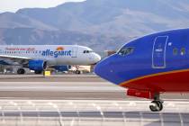 Planes taxi to the runway at McCarran International Airport in Las Vegas, Monday, Nov. 20, 2017 ...