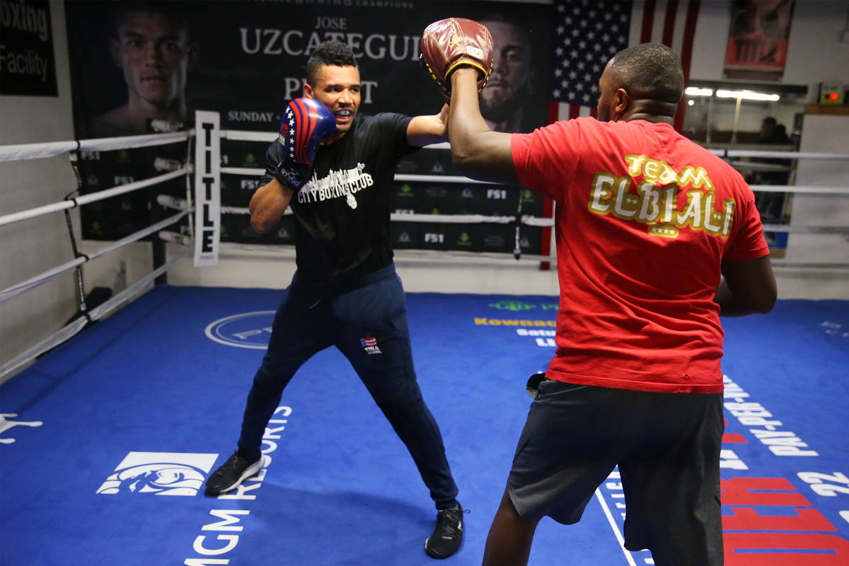 Rahim Gonzales, left, with his assistant trainer Marvin Rutta, during a workout at City Boxing ...