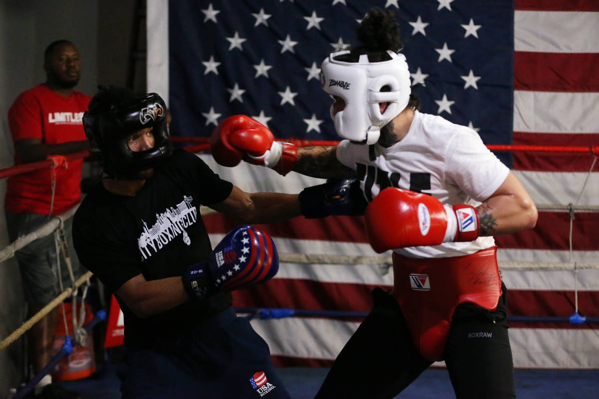 Rahim Gonzales, left, moves away from a punch against Bowe Van Dam during a sparring match at C ...
