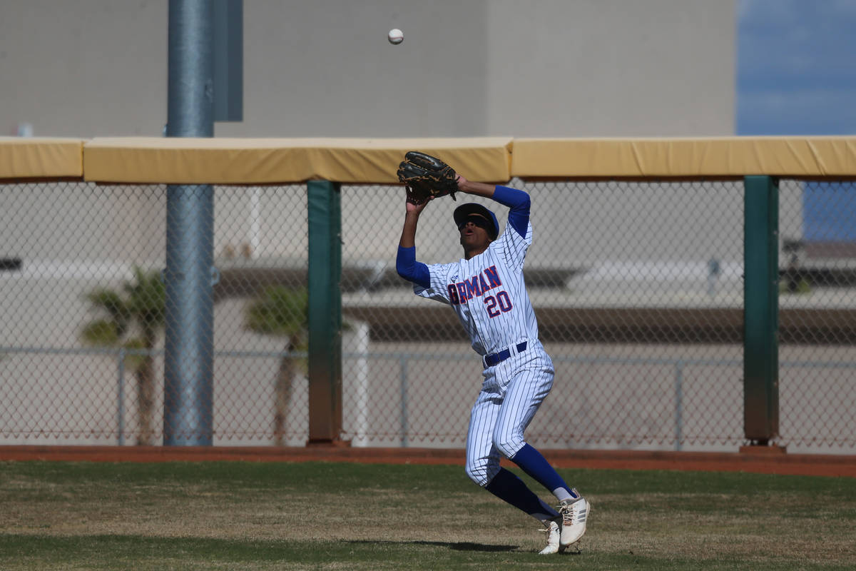 Bishop Gorman's Noah Gulley (20) makes a catch in the outfield against Desert Oasis in the base ...