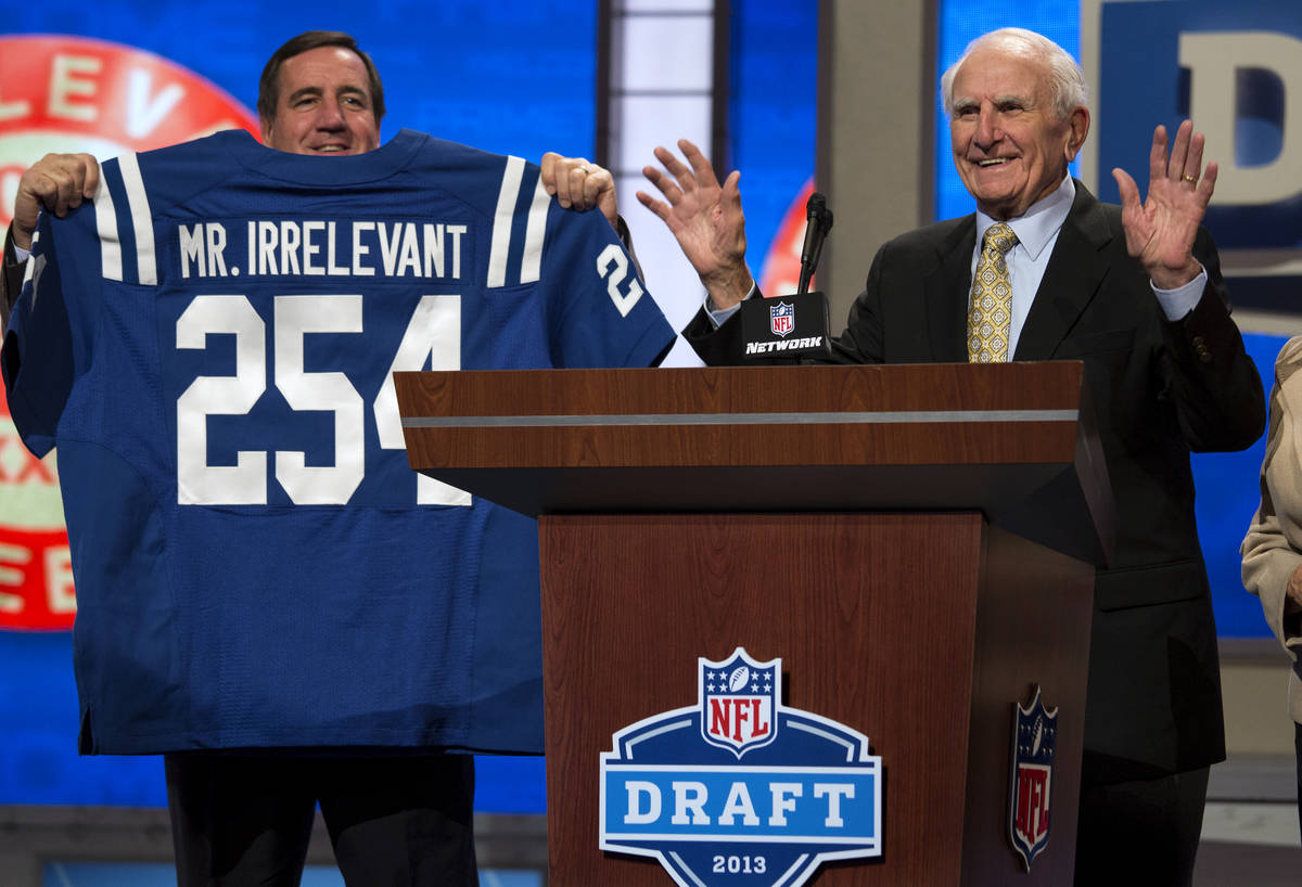 Former NFL receiver Paul Salata, right, announces the 254th overall pick of the NFL Draft, Satu ...