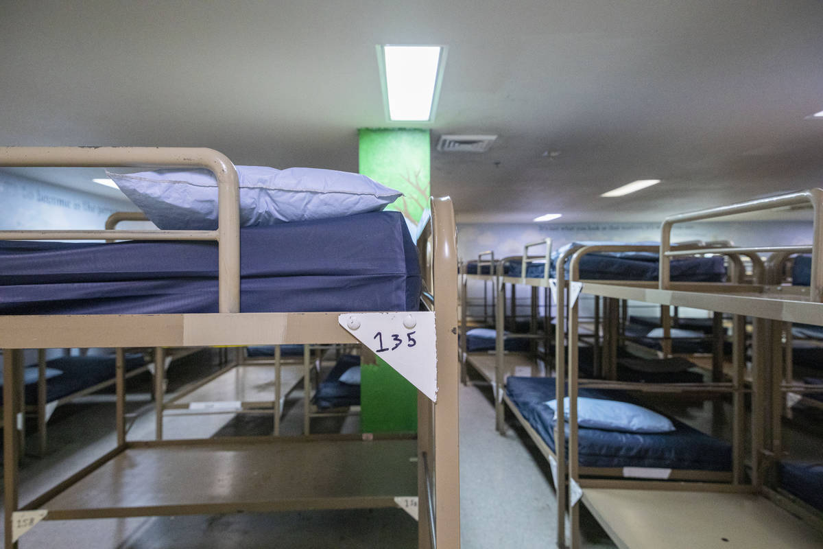 Rows of bunkbeds are seen with mattresses removed from multiple in effort to practice social di ...