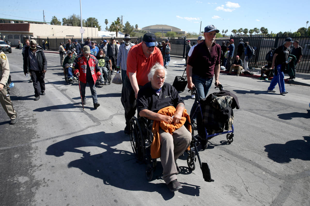 Homeless line up on Foremaster Lane in Las Vegas as Catholic Charities of Southern Nevada re-op ...