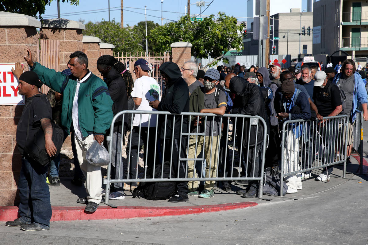 Homeless line up on Foremaster Lane in Las Vegas as Catholic Charities of Southern Nevada re-op ...